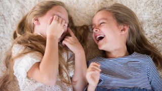 two girls laughing at jokes