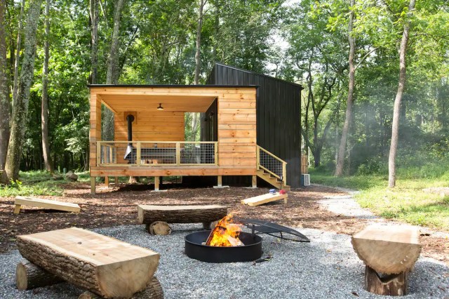 small rustic cabin and firepit