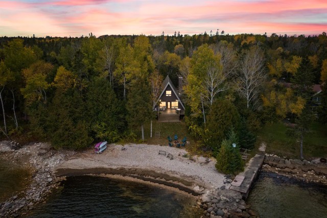 aerial view of a-frame in woods