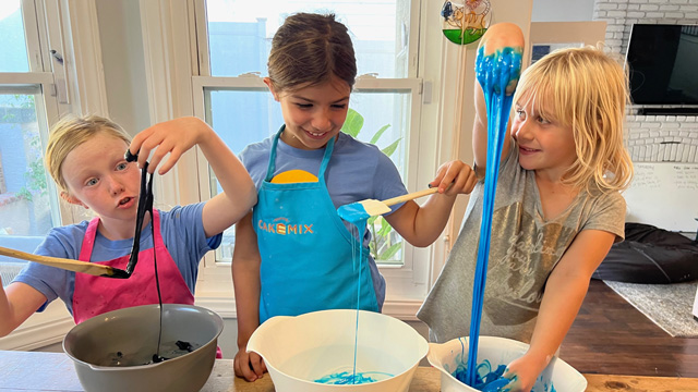 girls making slime, which is a fun science experiment for kids