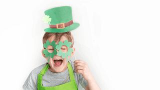 kid llaughing at St Patrick's Day jokes