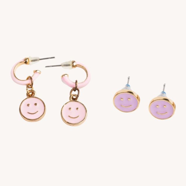 two sets of smiley face earrings