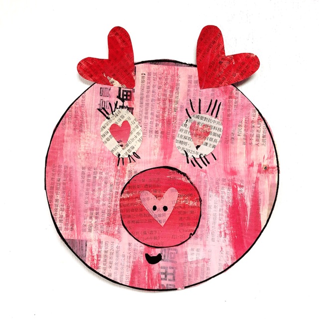 a pink paper pig using newspaper is a great art activity for toddlers