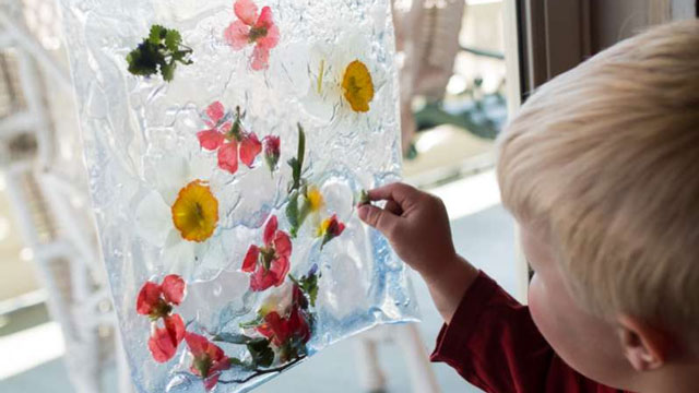 a picture of a boy enjoying spring sensory activities