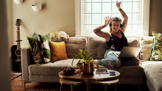 moms who do less are happier, like this woman who is listening to music and enjoying alone time