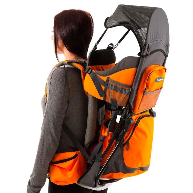 woman with hiking child carrier on back