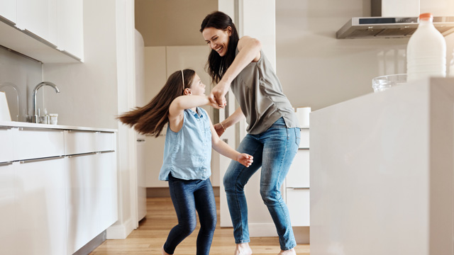 a mom and daughter dancing, one of the most fun activities for kids