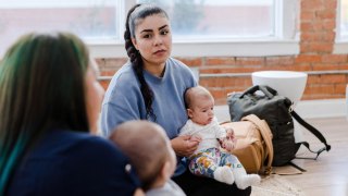 new mom looking upset with friend