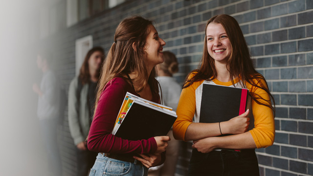 two girls laughing in high school 