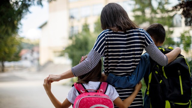 mom taking kids to school might have parental concerns