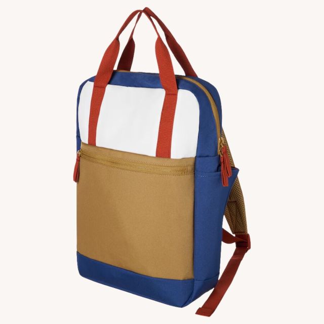 tan, red, white, and blue backpack