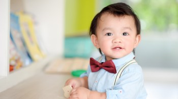 cute toddler boy wearing a bowtie with an old money name