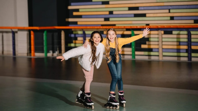 girls rollerblading at a summer program for kids