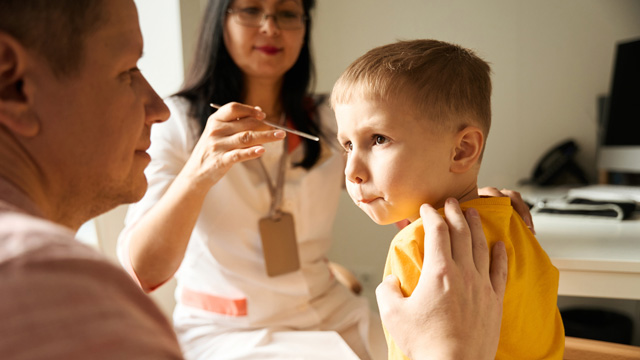 little boy prepping for a medical procedure