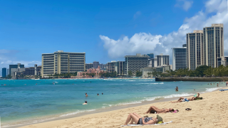 teens on the beach in Waikiki Hawaii