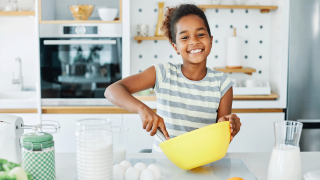 young girl making her own breakfast
