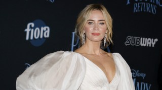 Emily Blunt in a white dress on a red carpet