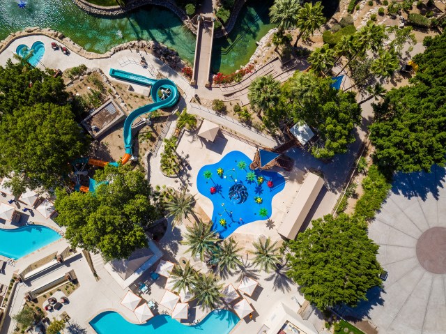 Aerial view of kids zone splash park at a resort.