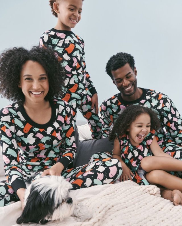 family wearing halloween ghost pajamas