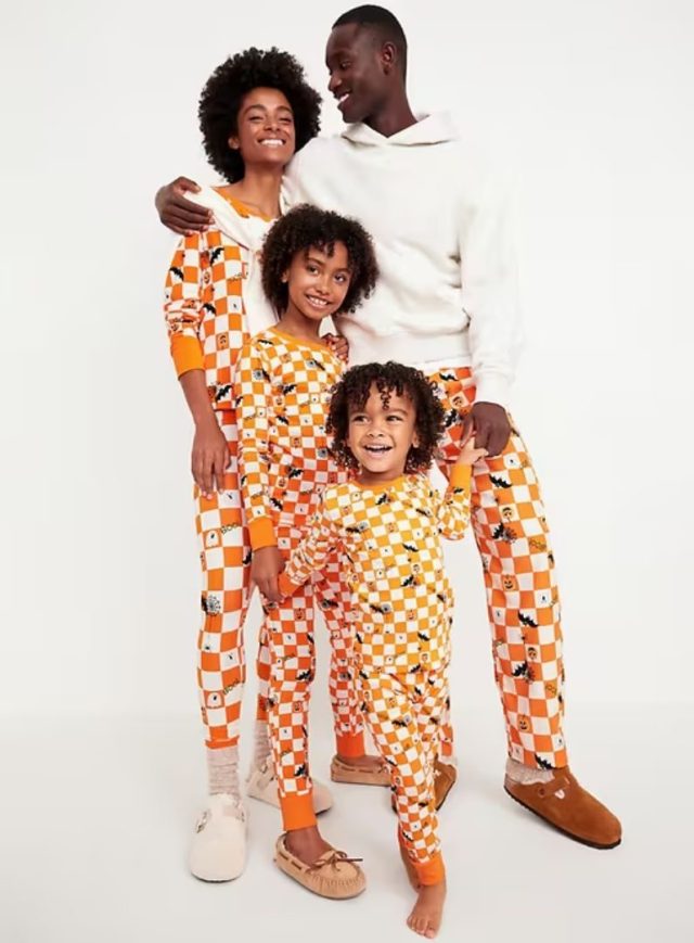 family wearing matching halloween pajamas