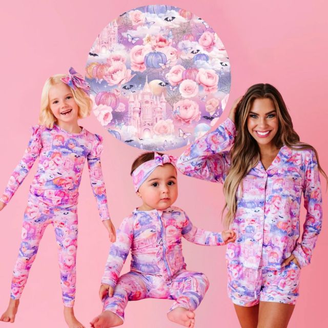 mother, child, and baby in pink halloween pajamas