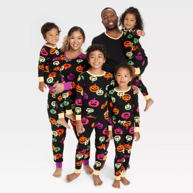 family wearing black halloween pajamas