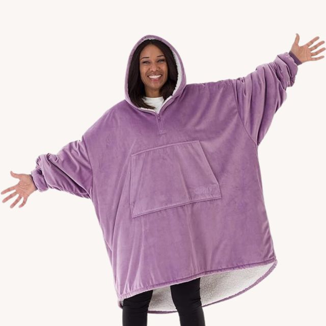 woman wearing a large purple hooded blanket hoodie