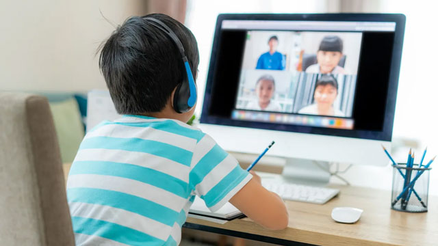 a picture of a boy learning english online, which is a good side job for moms