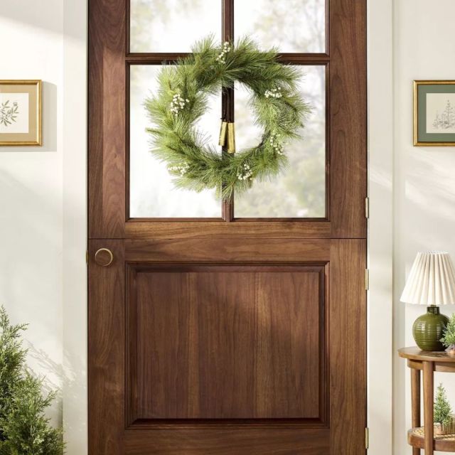 front door with rustic pine holiday wreath