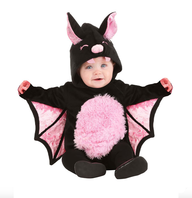 a baby in a pink and black hooded bat baby costume