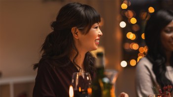 a woman at holiday dinner bracing herself to remember how to deal with insults from family