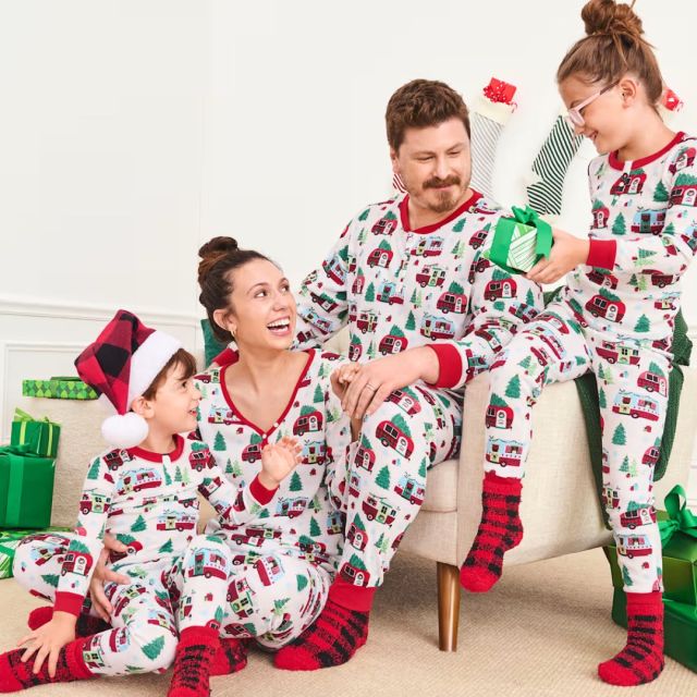 family wearing holiday camping pajamas