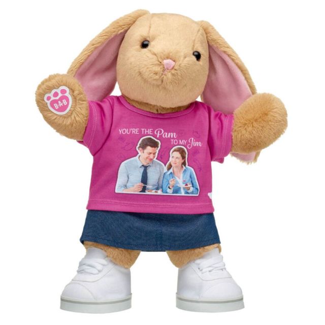 plush bunny wearing pink t-shirt, denim skirt, and white sneakers