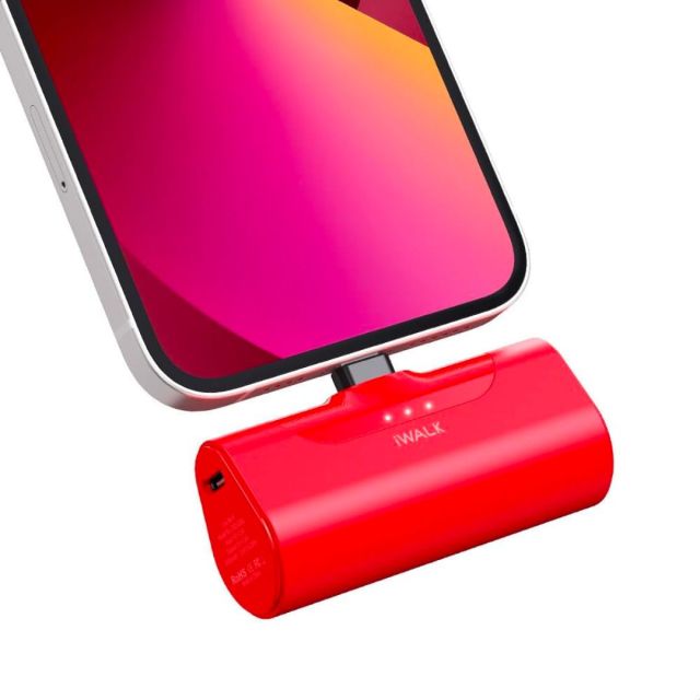 red portable iWalk phone charger connected to cell phone
