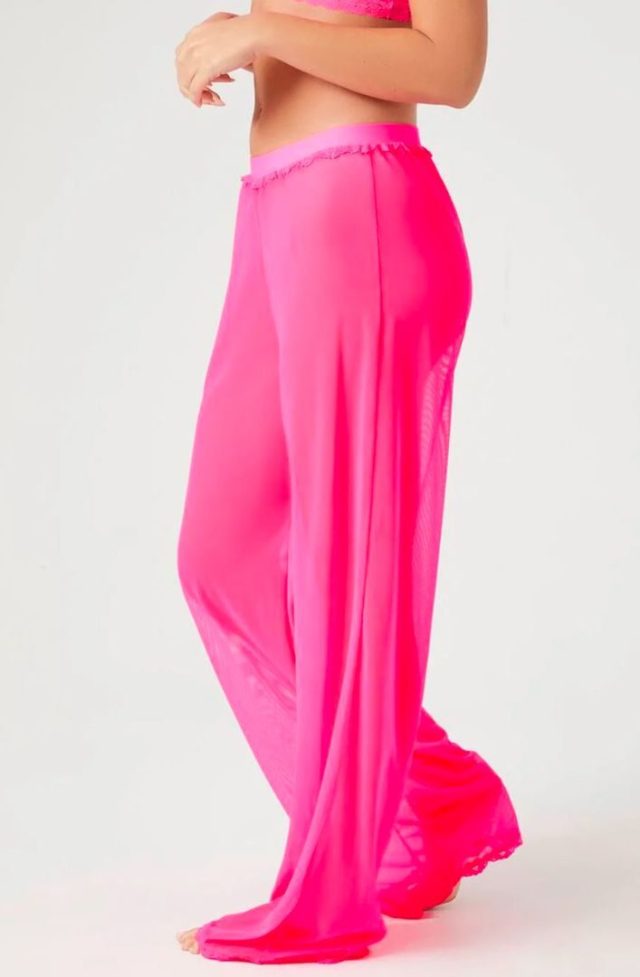 woman wearing pink loose mesh pajama pants