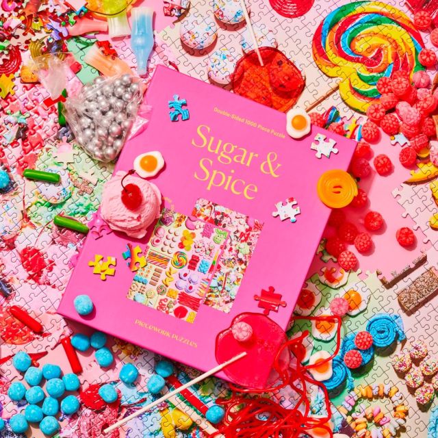 a boxed puzzle surrounded by candy