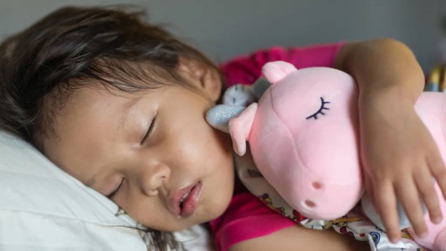 a toddler sleeping for a story anwering 'is melatonin safe for kids'