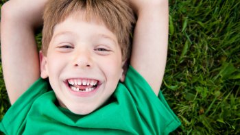 boy laughing at st. patrick's day jokes for kids
