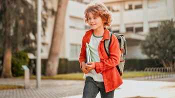 boy walking to school by himself