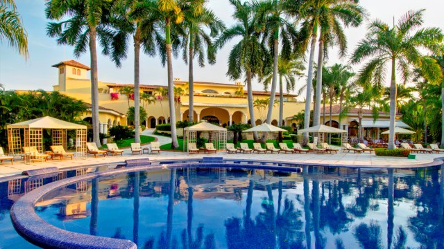 The beautiful pool and Spanish facade at Casa Velas all-inclusive in Puerto Vallarta
