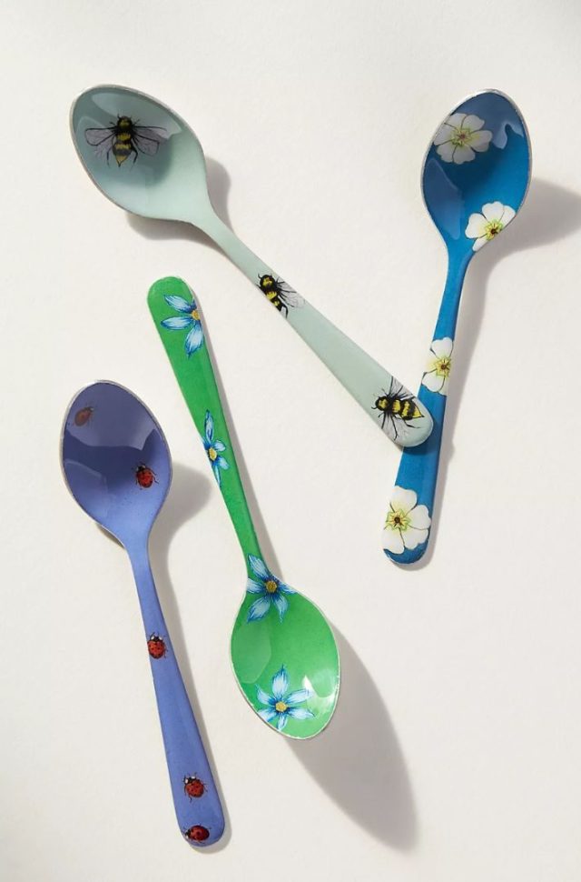 four decorated tea spoons