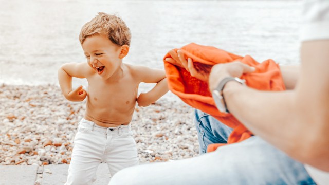 toddler being weird for a photoshoot, one of the best family photo ideas with toddlers