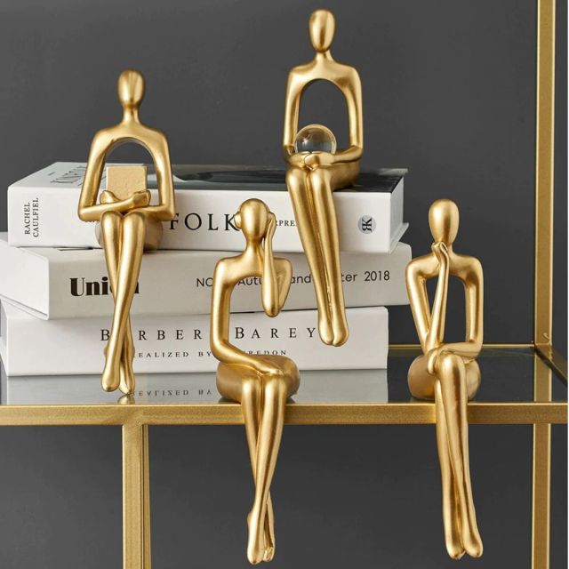 set of 4 gold bookshelf figurines