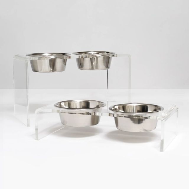 two sets of silver and acrylic pet bowl sets