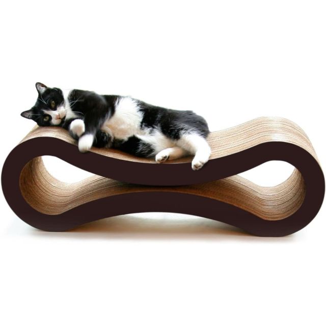 black and white cat laying on a modern scratcher lounger