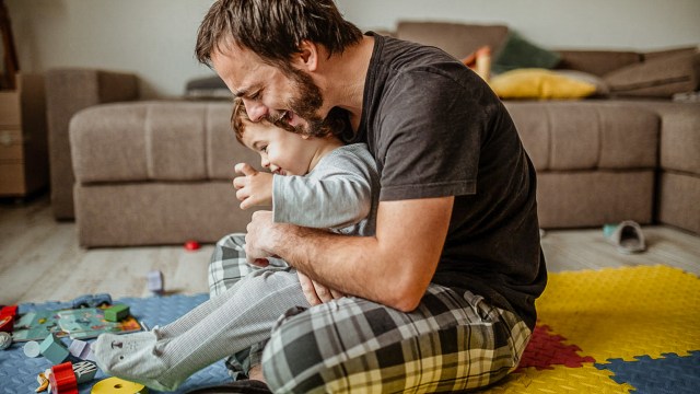 dad using sensory moves to calm toddler before bedtime