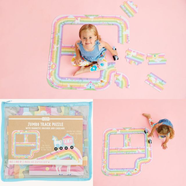 rainbow track puzzle and little girl playing