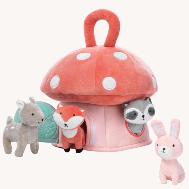 plush mushroom house toy with small woodland animals