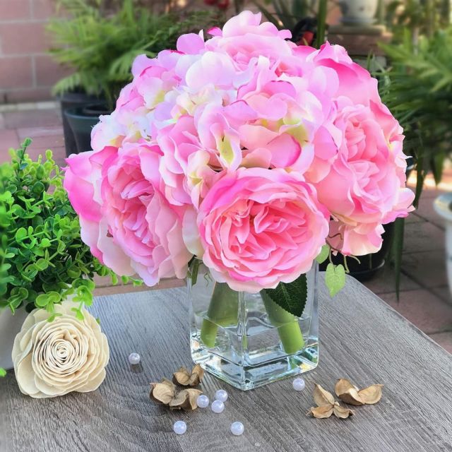 silk pink peonies in vase on tabletop
