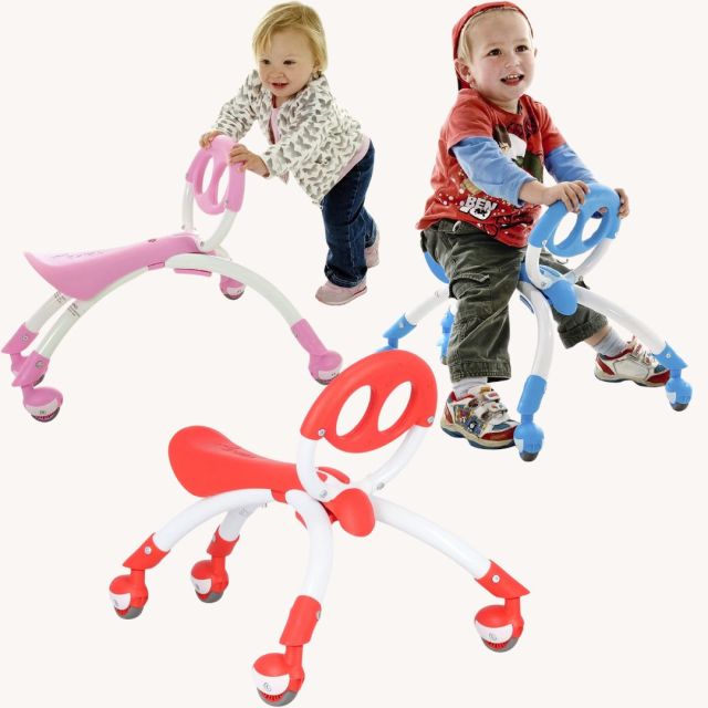 two children playing with the pewi toddler ride on toy